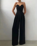 Black spaghetti strap overall with sweetheart neckline and flared hem, front view.