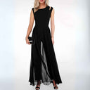 Black sleeveless jumpsuit with shoulder cutouts and sheer overlay skirt, front view.