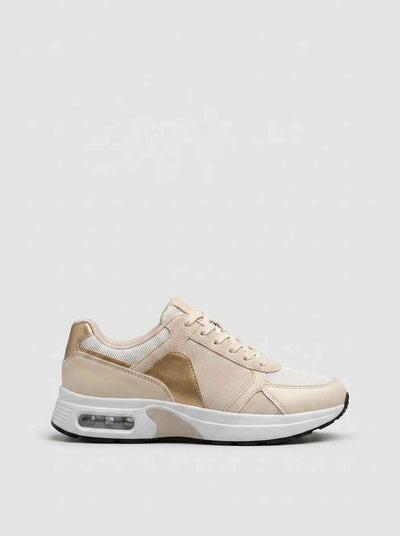 Air cushion lace-up trainers in beige and gold colour-block, front view on white background — women's retro running style trainers.