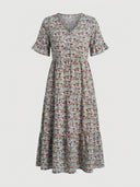 Light blue floral midi dress with V-neck and tiered skirt, front view on white background.