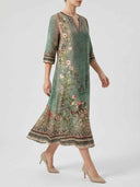 Green floral midi dress with V-neck and patterned trim, angled view on white background.