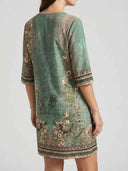 Green floral midi dress with elbow-length sleeves, back view on white background.