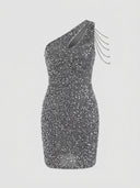 Gray one-shoulder glitter mini dress with chain shoulder detail, front view on white background.