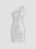 White one-shoulder glitter mini dress with silver chain details, front view on a light background.