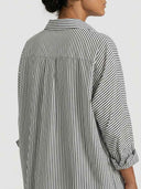 Black and white striped mini dress, back view, with cuffed sleeves.