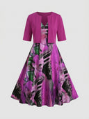 Magenta bolero over a purple, green, and black abstract print maxi dress, front view.
