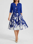 Blue floral V-neck maxi dress with matching bolero jacket, front view on white background.