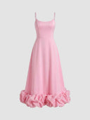 Pink mini dress with spaghetti straps and ruffled hem, front view on white background.