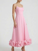Pink midi dress with spaghetti straps and ruffled hem, front view on white background.