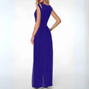 Royal blue jumpsuit with shoulder cutouts, shown from the back on a white background.