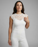 White jumpsuit with lace yoke and cap sleeves, front view on a light gray background.