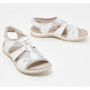 White closed toe cushioned walking sandals with woven lattice upper, adjustable heel strap and cream flat sole, front and side view.