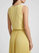 Yellow sleeveless maxi dress with pleated skirt, shown from the back on a white background.