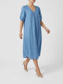 Blue midi dress with V-neck, pleated front, and puffed sleeves, angled front view.
