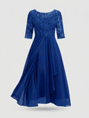 Royal blue midi dress with embroidered bodice, sheer 3/4 sleeves, and draped skirt, front view.