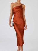 Rust one-shoulder bodycon midi dress with draped bodice, front view on white background.