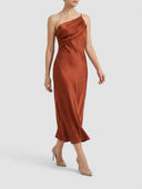Burnt orange one-shoulder bodycon midi dress with draped bodice, angled front view.