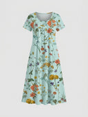 Light blue mini dress with colorful floral print, short sleeves, and scoop neck, front view.