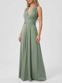 Long sleeve wrap mini dress in sage green with deep V-neck and crisscross waist detail, front view.