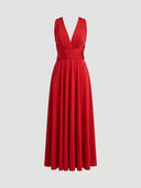 Long sleeve wrap mini dress with V-neck and tied waist, front view.
