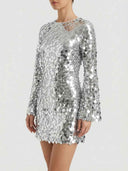 Silver sequin long sleeve mini dress, angled front view on white background.