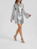 Silver sequin mini dress with long bell sleeves, angled view on a white background.