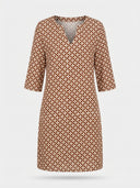 Brown and cream geometric print mini dress with 3/4 sleeves and split-neck, front view.