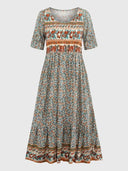 Bohemian tiered mini dress with floral print, front view on a neutral background.