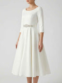 White midi dress with boat neck, 3/4 sleeves, and jeweled belt, front view.