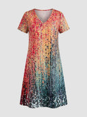 V-neck mini dress with short sleeves and abstract colorful pattern, front view on a white background.