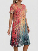 Abstract print mini dress with short sleeves, angled view.