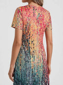 Back view of Hannah elegant long sleeve mini dress with colorful abstract print.