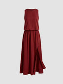 Red sleeveless maxi dress with elastic waist and side slit, front view.