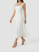 White square neck A-line mini dress with layered skirt, angled front view.