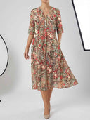 Red and beige floral midi dress with V-neck and pockets, front view.