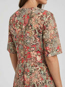 Floral patterned dress with short sleeves, back view on a white background.