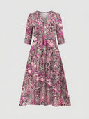 Pink floral midi dress with V-neck and three-quarter sleeves, front view on white background.