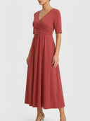 Rust midi wrap dress with V-neck and short sleeves, angled front view on white background.