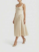 Beige sleeveless corset midi dress with full skirt, angled front view on a white background.