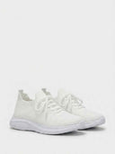 Pair of women's white lace-up trainers with textured knit upper and white cushioned outsole, angled view.
