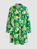 Green and white floral print mini dress with long sleeves and collar, front view.