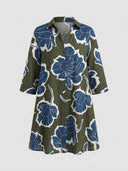 Olive green mini dress with blue and white floral print, button-down front, and collar, front view.
