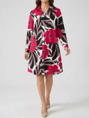 White mini dress with pink, black, and gray floral print, front view.