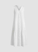 White sleeveless V-neck mini dress with front buttons and tiered skirt, front view.