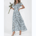 Light blue botanical print maxi dress with flutter sleeves, front view.