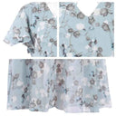 Light blue botanical print maxi dress with ruffle sleeves and button detail, close-up.
