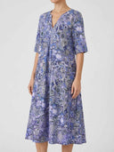 Purple patterned tiered boho mini dress with V-neck, front view on a white background.