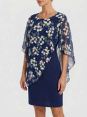Navy mini dress with floral chiffon overlay, angled front view.