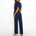 Navy blue wide-leg jumpsuit with short sleeves and keyhole back, rear view on white background.