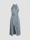 Slate blue satin halter midi dress with waist tie and thigh slit, front view.